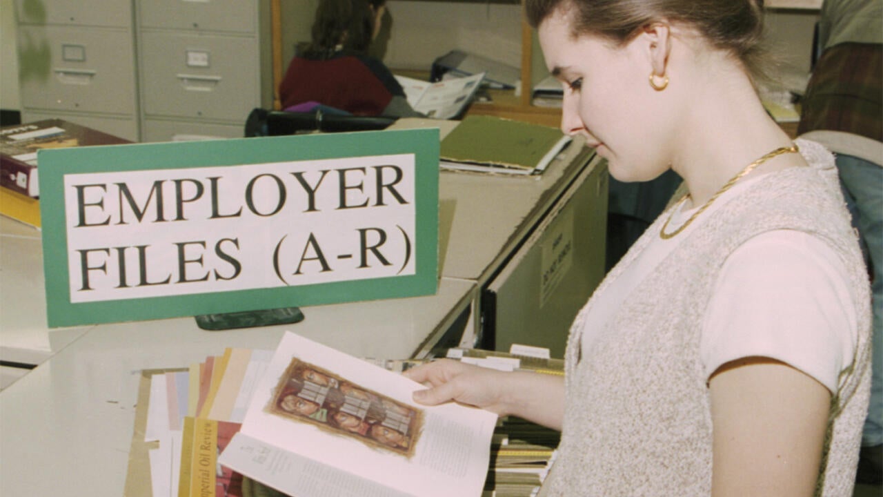 Co-op student looking at employer files