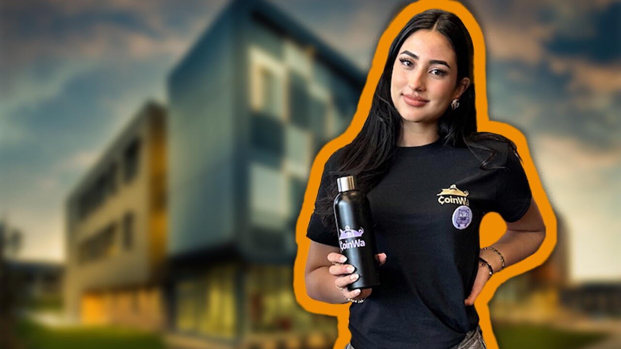 Naimah Venezia holding brabded water bottle against university building background
