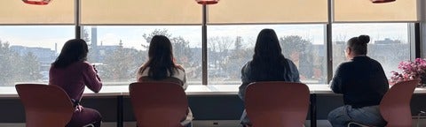students facing the window studying 