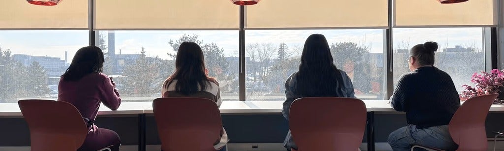 students facing the window studying 