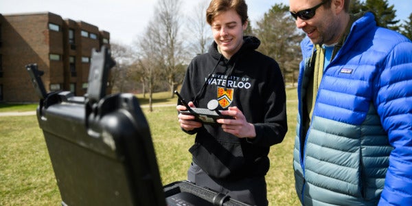 A Geography and Environmental Management student works together with a professor.
