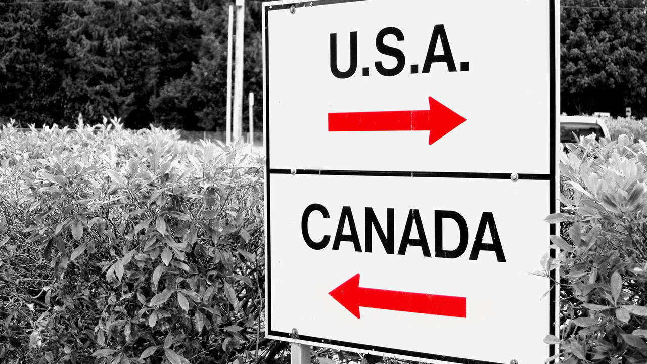 Direction signs on post featuring arrow and the words 