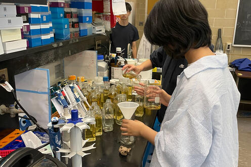 Undergrad student working on an experiment in a research lab 