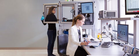 Two students working in a lab