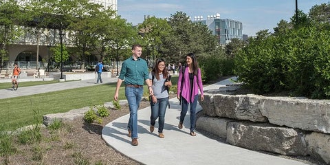 students walking on path on campus