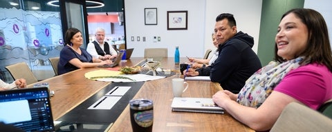 a group of people at a conference table