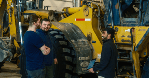 City of Iqaluit Service Technician Quinlin Iredale, Heavy Equipment Operator Robert Duffy, and Waterloo co-op Student Ahraz Yousuf at the city's operation center
