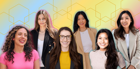 6 women in front of blue, yellow, pink gradient background
